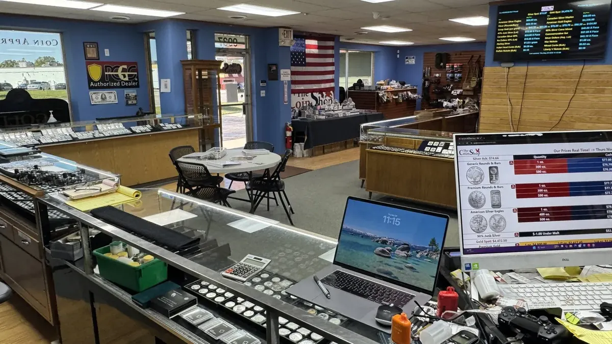 The Coin Shop counter with SpotPro on screen and a live price board